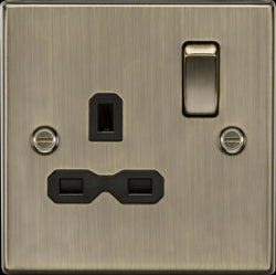 Knightsbridge 13A 1G DP Switched Socket with Black Insert - Square Edge Antique Brass - CS7AB